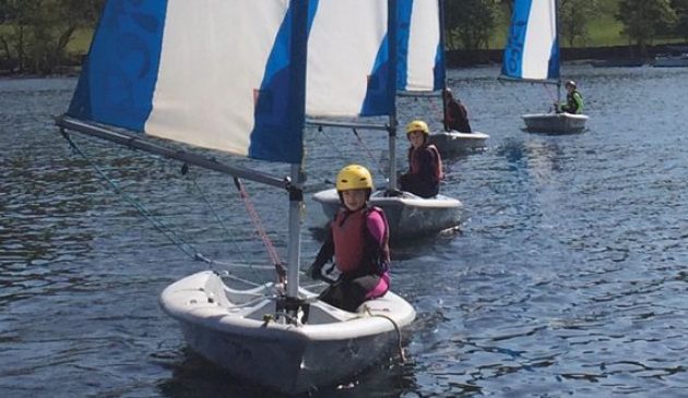 girl sailing on a lake