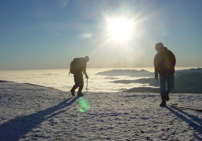 hikers standing on top of helvellyn summit