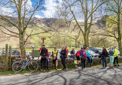 lake district cyclist standing by road Skelwith