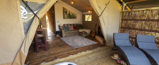 Luxury Safari Suites' terrace with hot tun and lounge, glamping in the Lake District