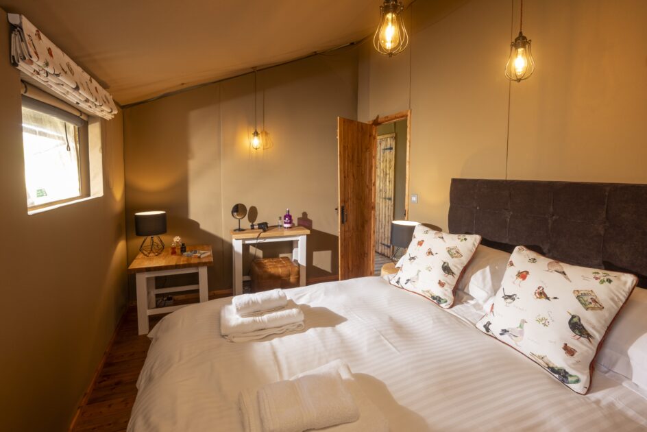 Safari Suite's bed, glamping near Ambleside at Skelwith Fold, Lake District